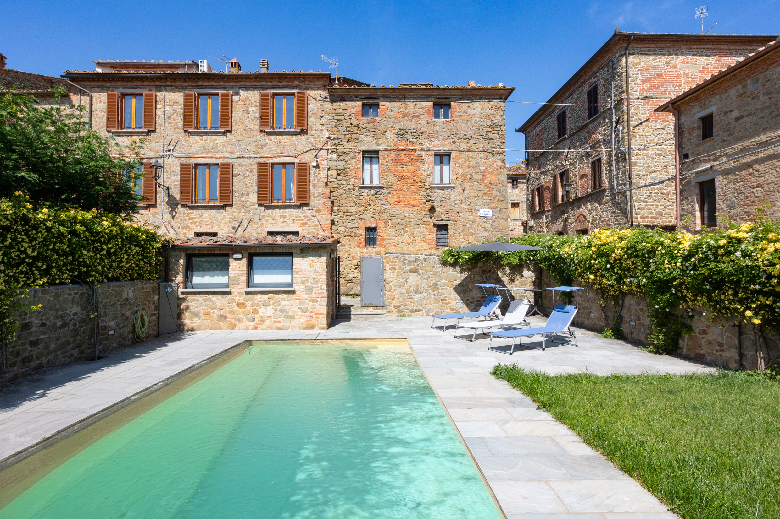 Restored terraced house with garden and pool in a medieval village