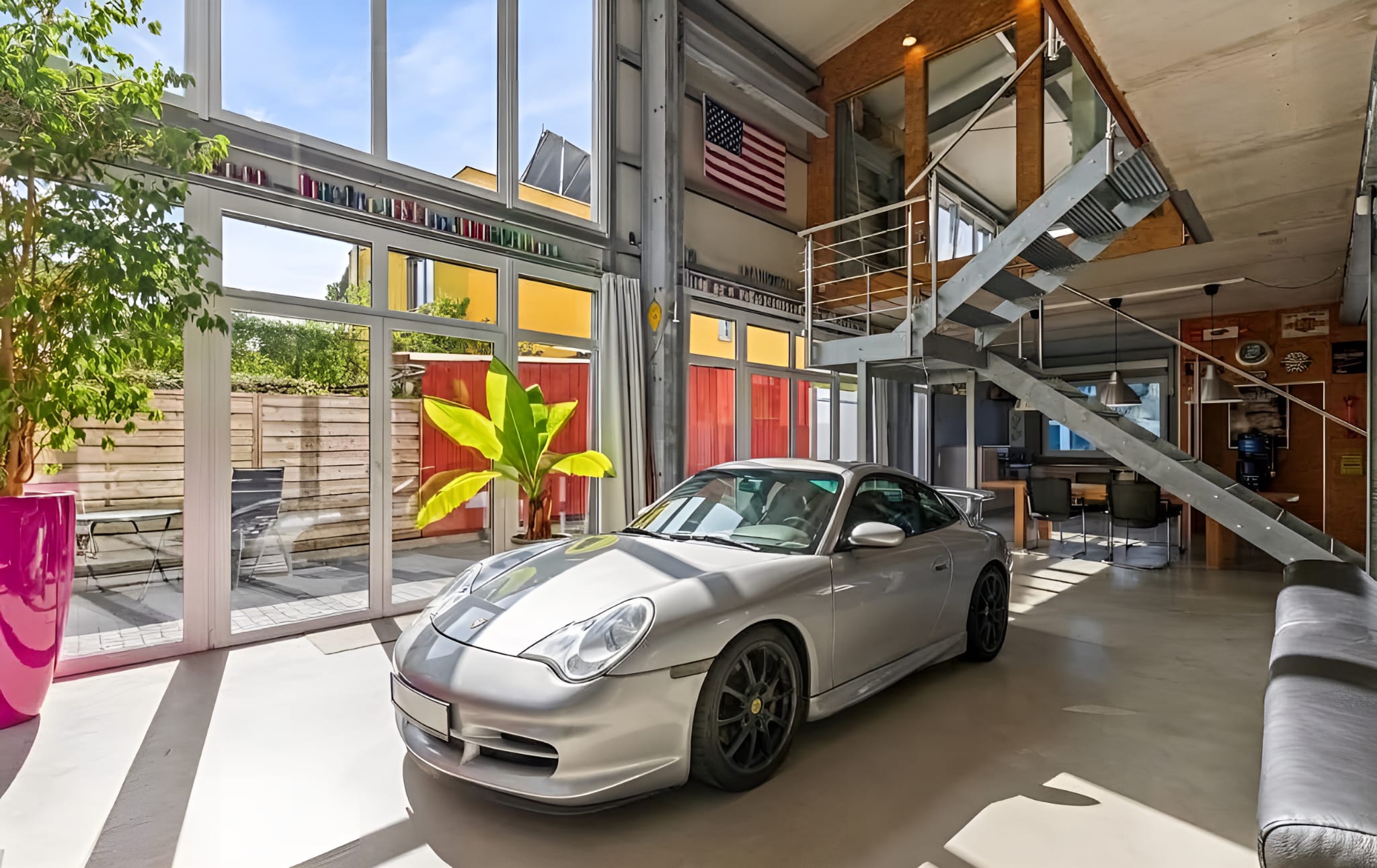 Industrial loft with character – a home for individualists and car enthusiasts [AI-modified]