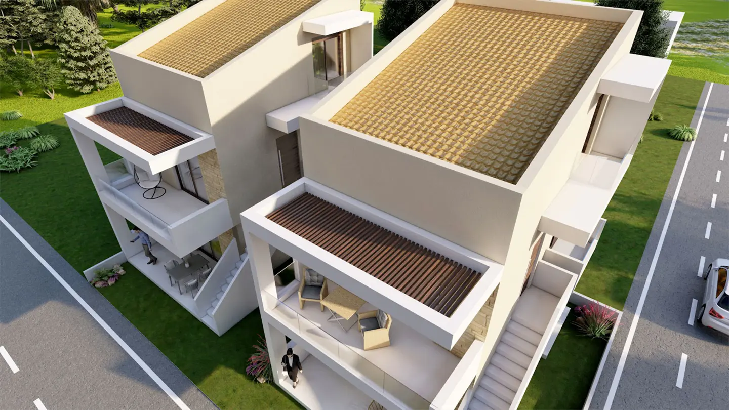 High-angle view of two modern, beige multi-story townhouses with flat roofs, balconies, and outdoor seating areas.