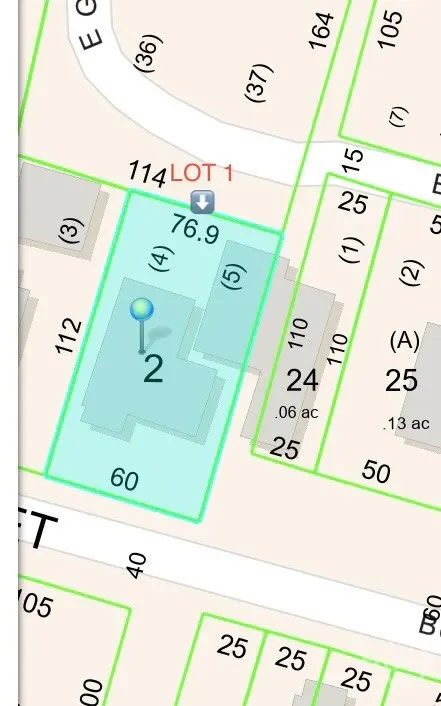 Real estate map showing lot lines, property dimensions, and a blue pin marking a specific location.