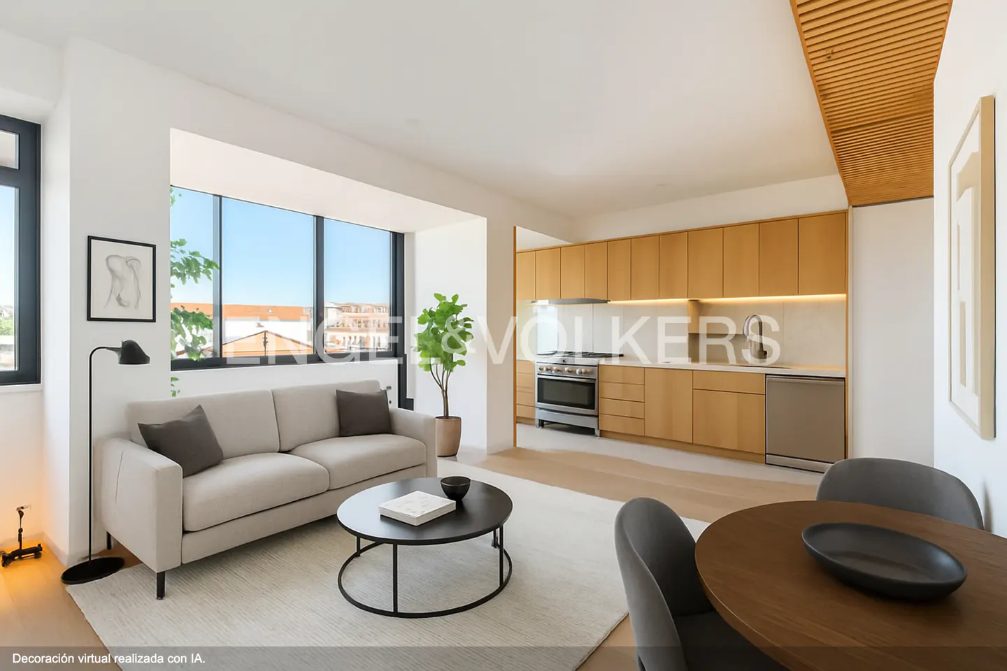 Open-concept living space with a beige sofa, round coffee table, and a modern kitchen with wood cabinets.