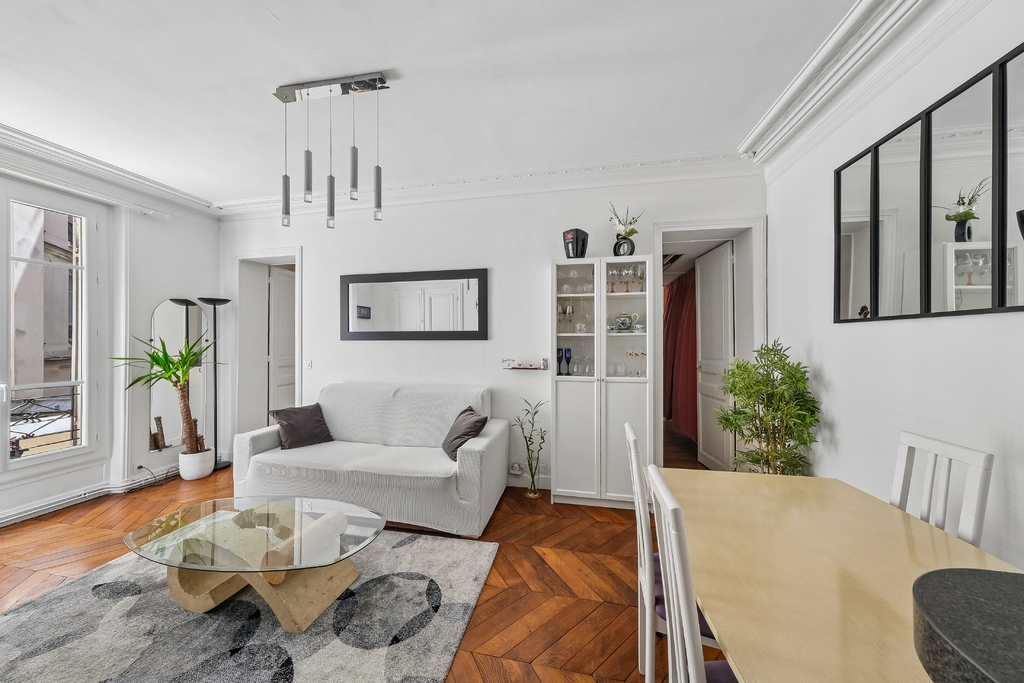 Moulin Rouge District – Elegant Two-Bedroom Haussmannian Apartment with Authentic Period Features