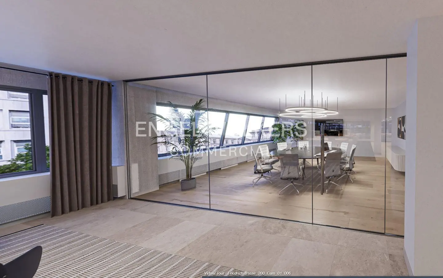 Office space with a glass-walled conference room, featuring a long table, chairs, and a modern lighting fixture.