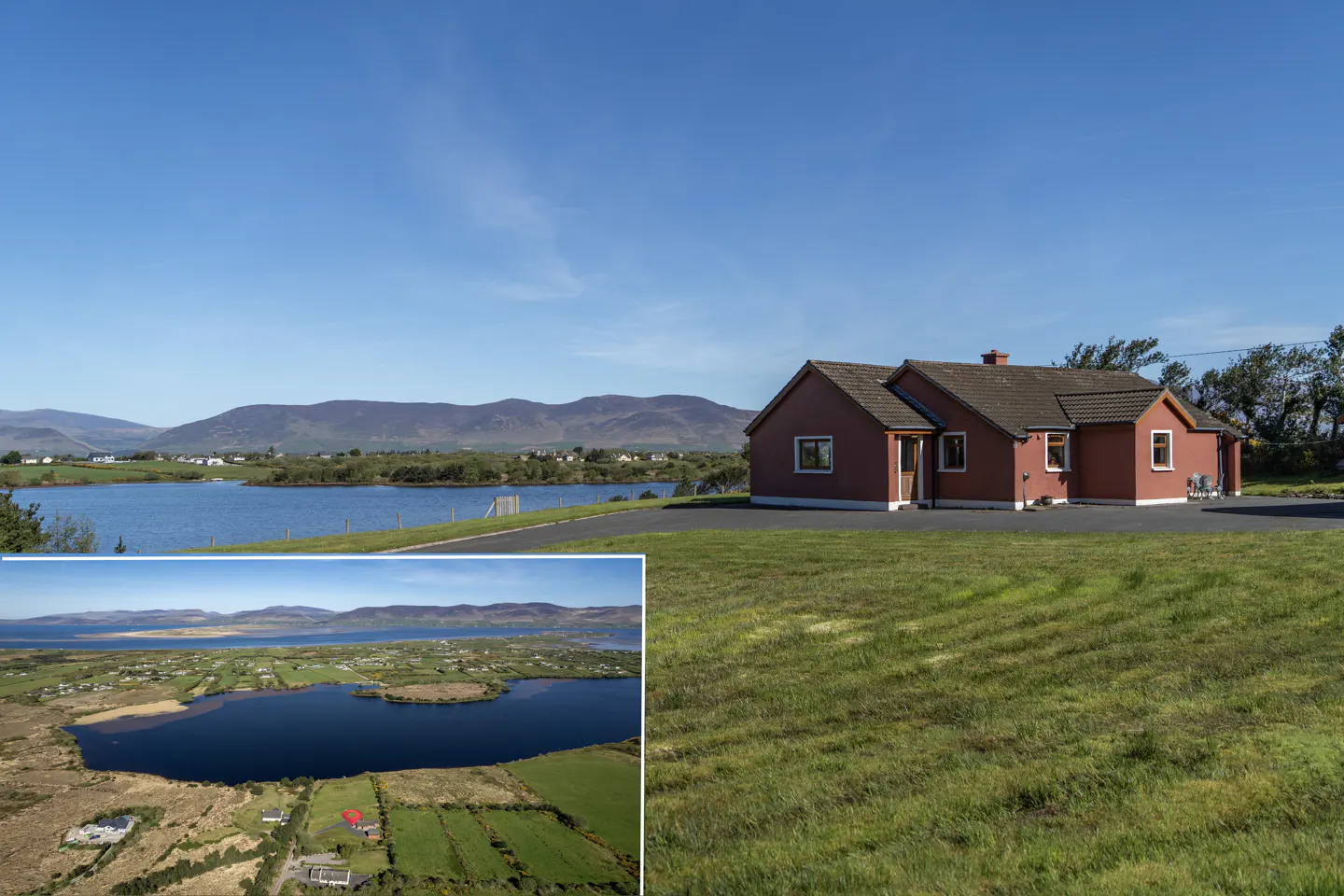 A red house sits on a green lawn with a lake and mountains in the background. An inset shows an aerial view of the house and surrounding landscape.