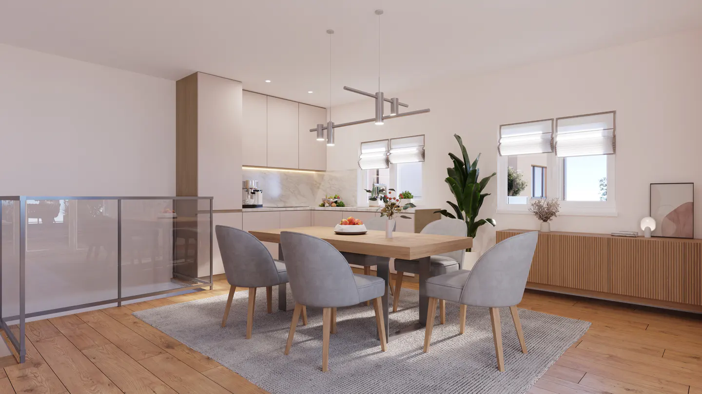 Bright, modern dining area with a wood table, gray chairs, and a light gray rug. Kitchen in the background with white cabinets and stainless steel appliances.
