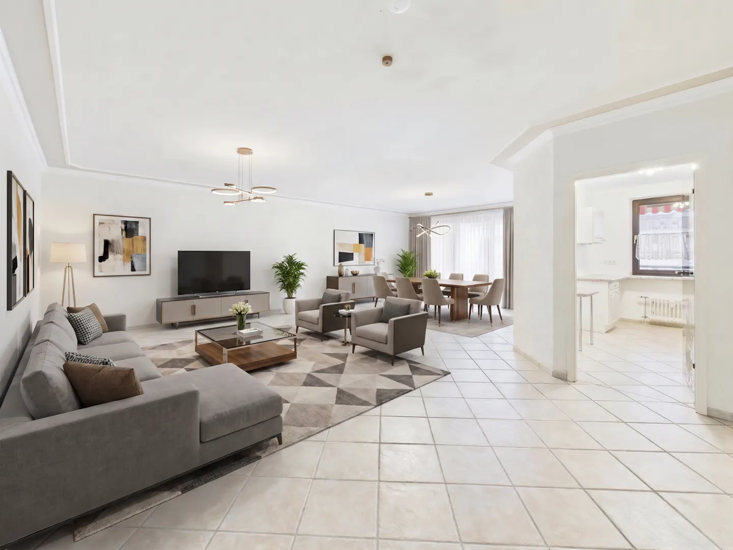 Bright, open-concept living and dining area with gray sectional, chairs, and dining set. White walls and tile floors. Kitchen visible.