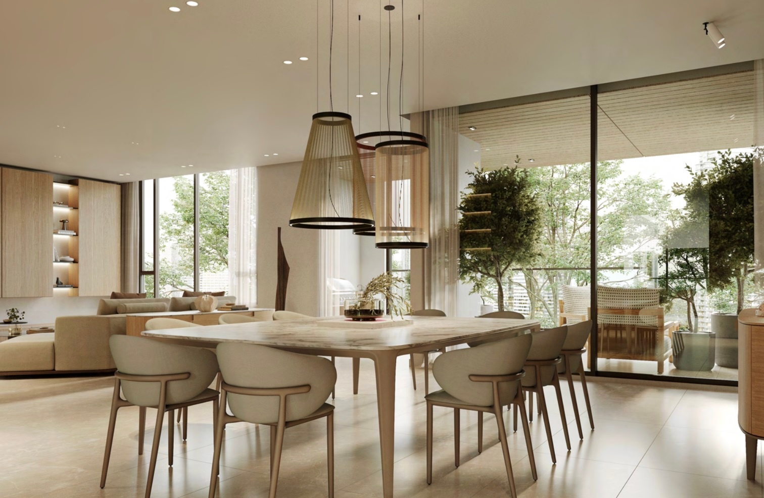 A bright, modern dining room features a marble table with six chairs, pendant lights, and large windows overlooking lush greenery.