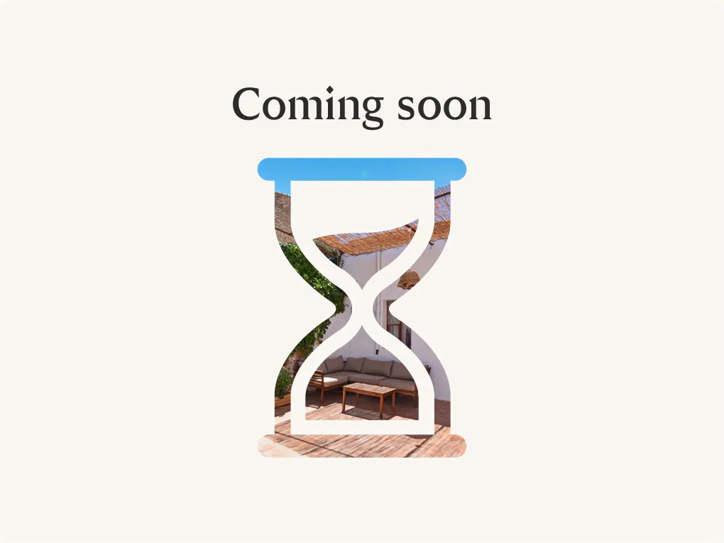 "Coming soon" text above a blue hourglass shape filled with a patio scene.