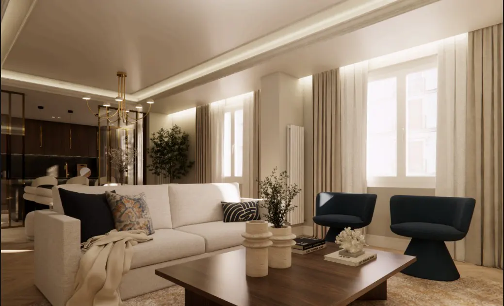 Living room with a white sofa, dark wood coffee table, and two blue chairs near a window with beige curtains.