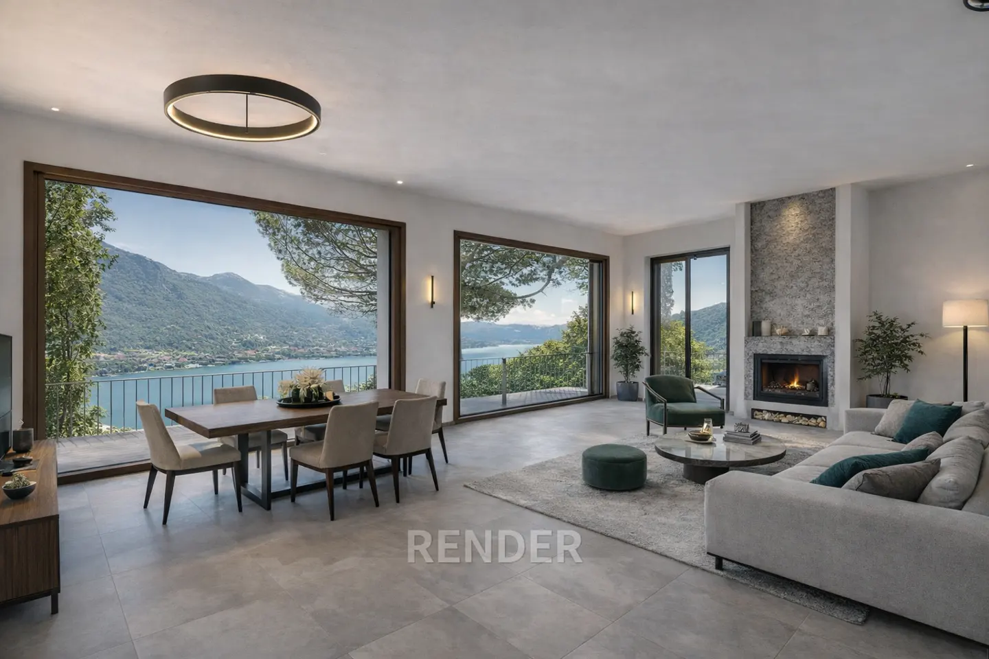 Open-concept living room with a dining table, sofa, and fireplace. Large windows offer a view of a lake and mountains.