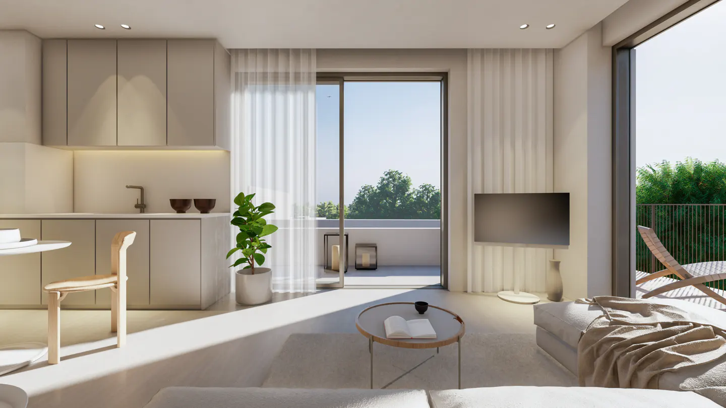 Bright, modern apartment interior with beige cabinets, white walls, and a balcony view of lush greenery. A potted plant adds a touch of nature.