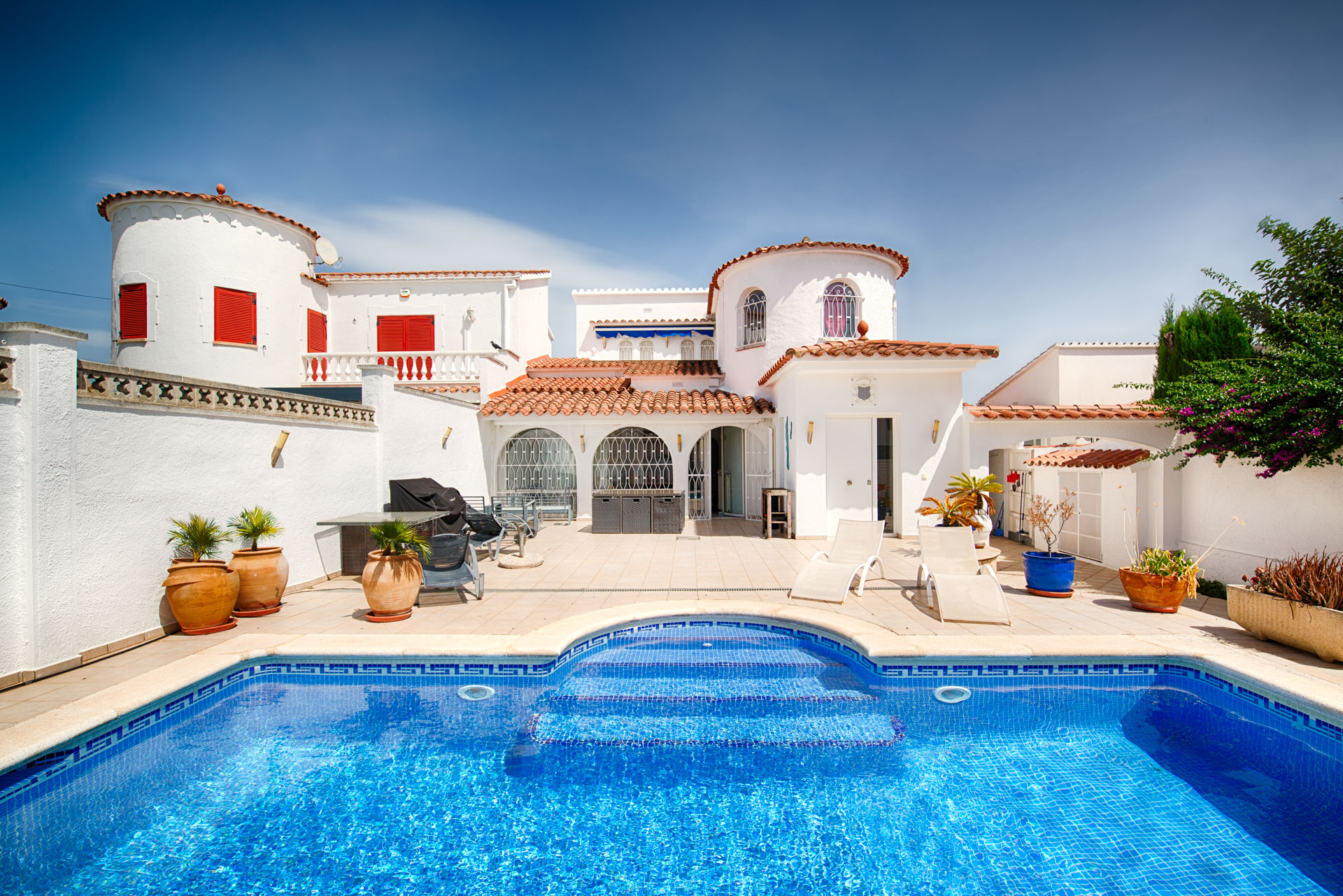 Mediterranean home with a pool and spacious outdoor areas