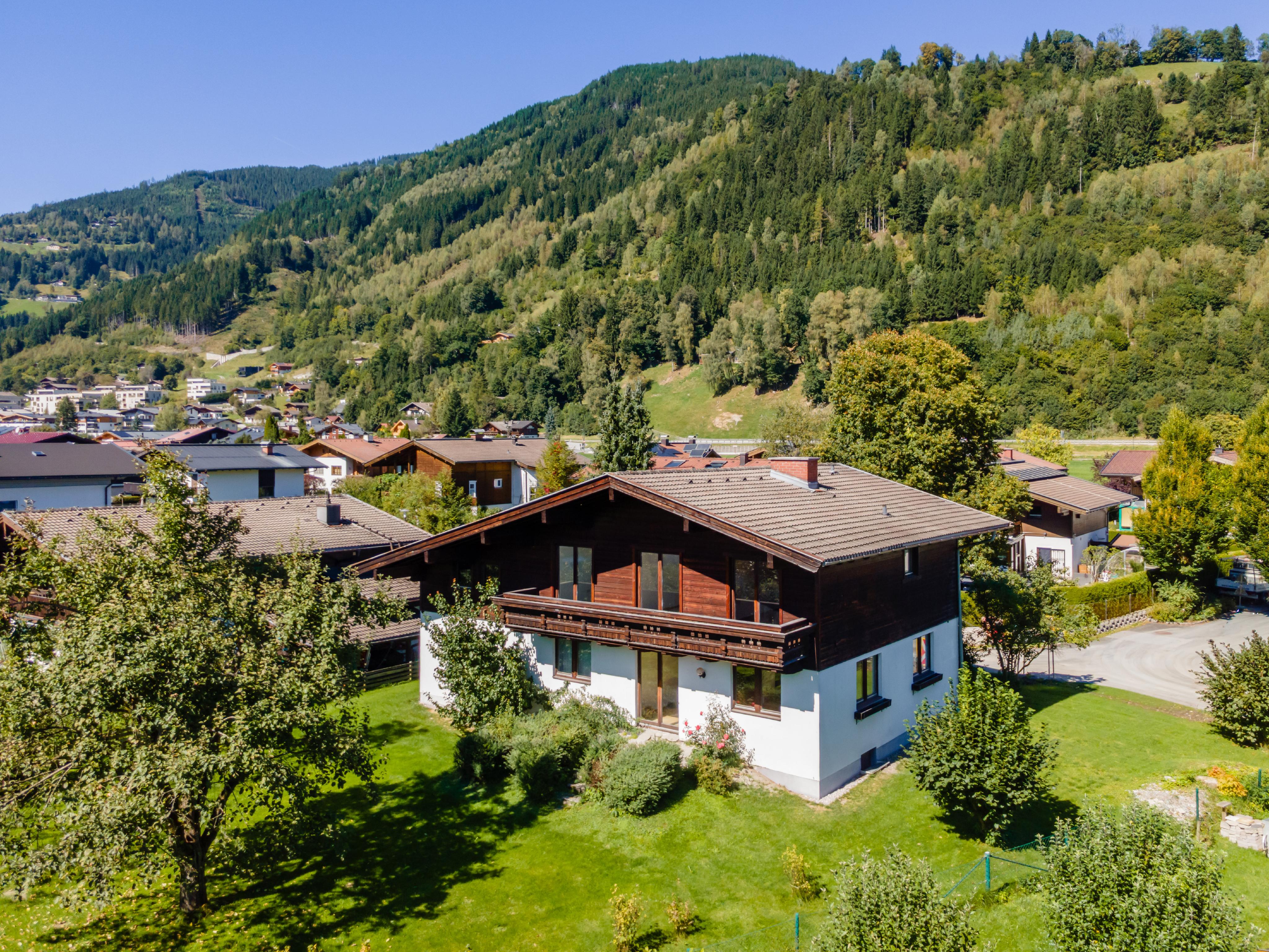 Sunny plot with existing buildings and glacier views