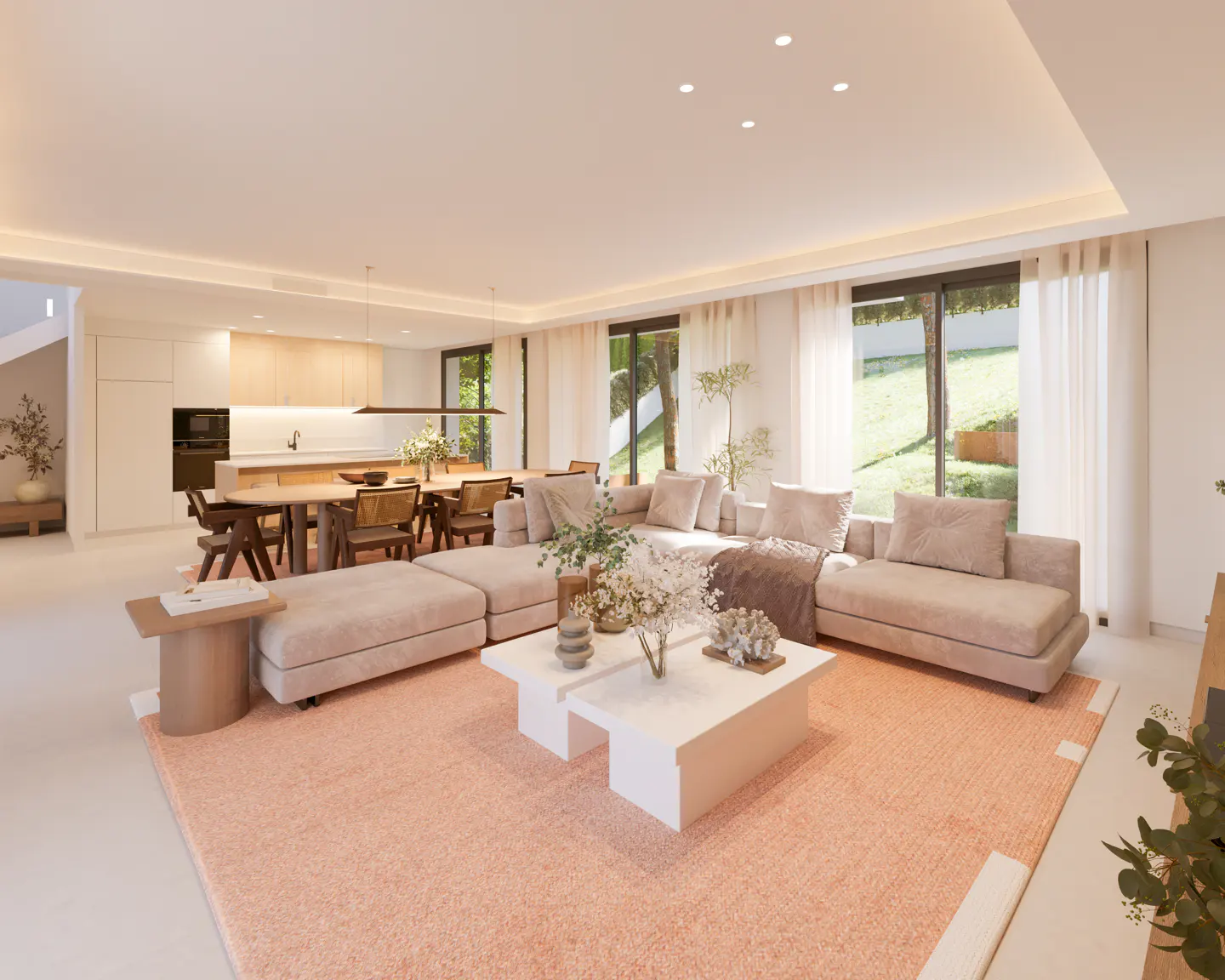 Modern open-plan living room with a beige sectional sofa, white coffee tables, and a peach rug, overlooking a green yard.
