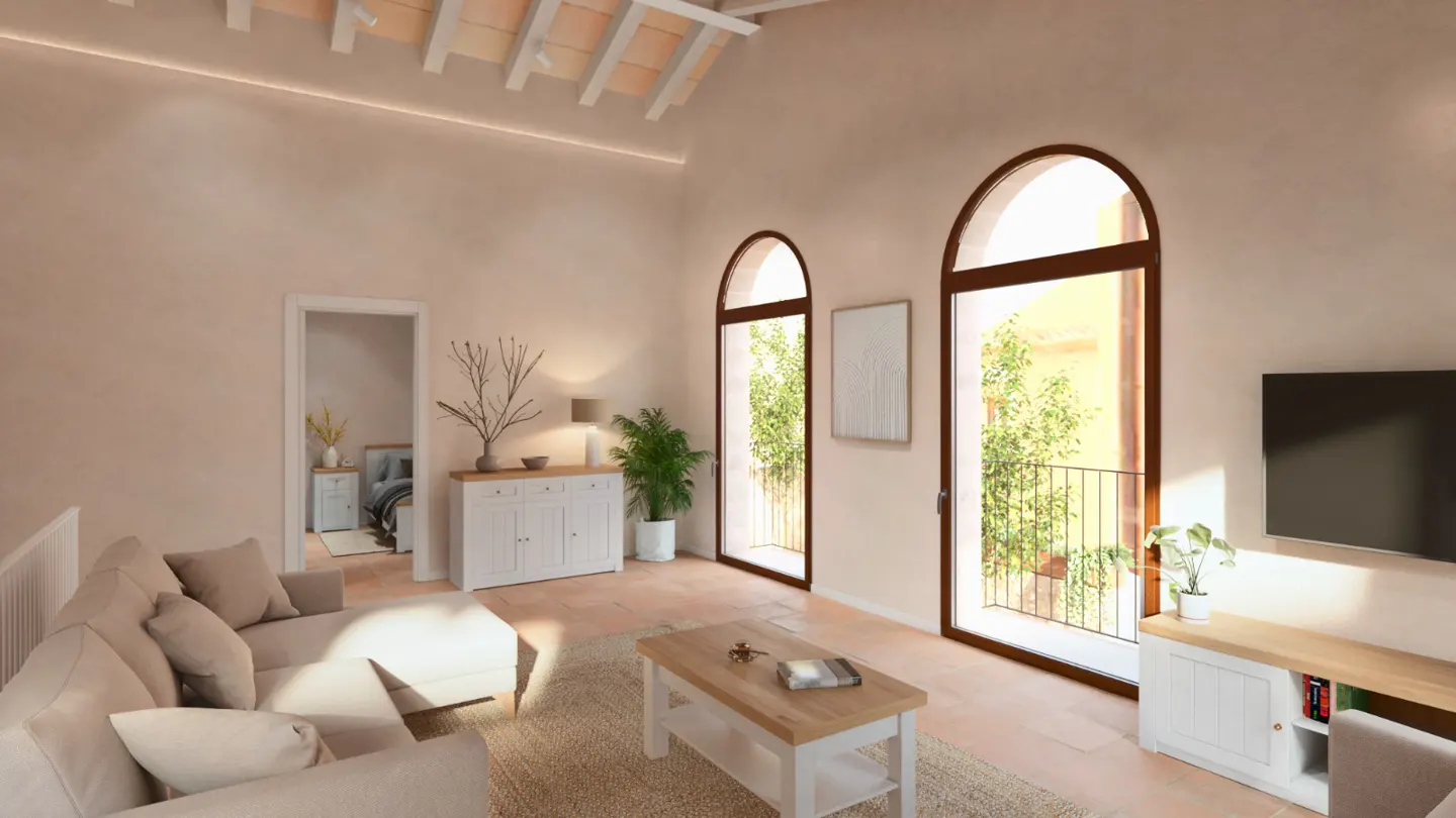 Living room with beige walls, terracotta floors, and arched windows. A beige sofa, white cabinets, and a light wood coffee table furnish the space.