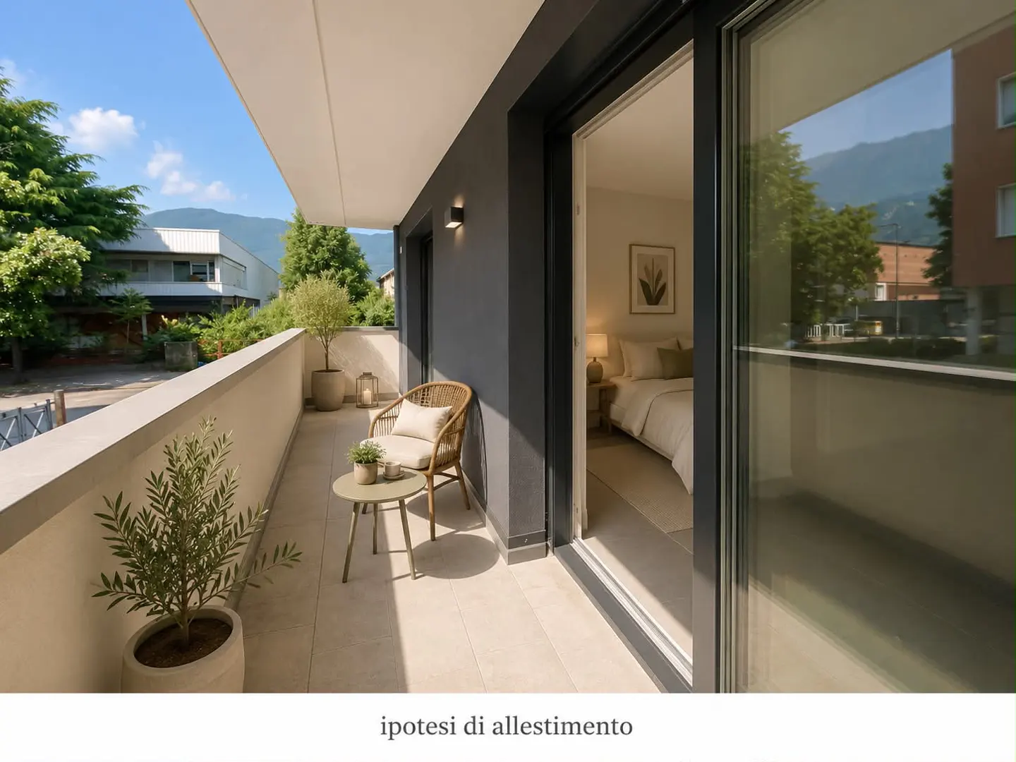 Balcony with a wicker chair, small table, and potted plants. Sliding glass doors open to a bedroom with a bed and nightstand.