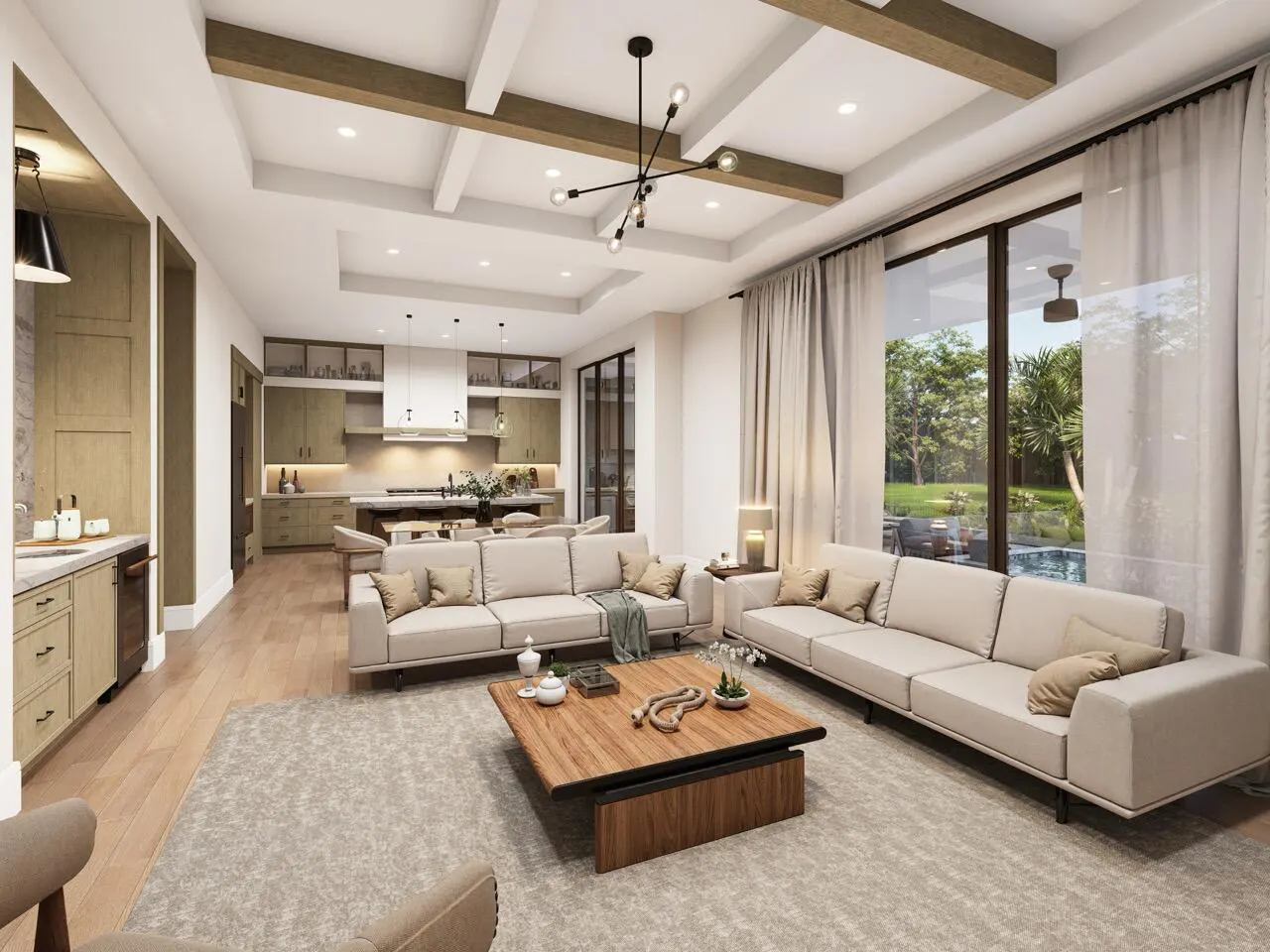 Open-concept living room with beige sofas, wood coffee table, and kitchen in the background. Large windows with sheer curtains.