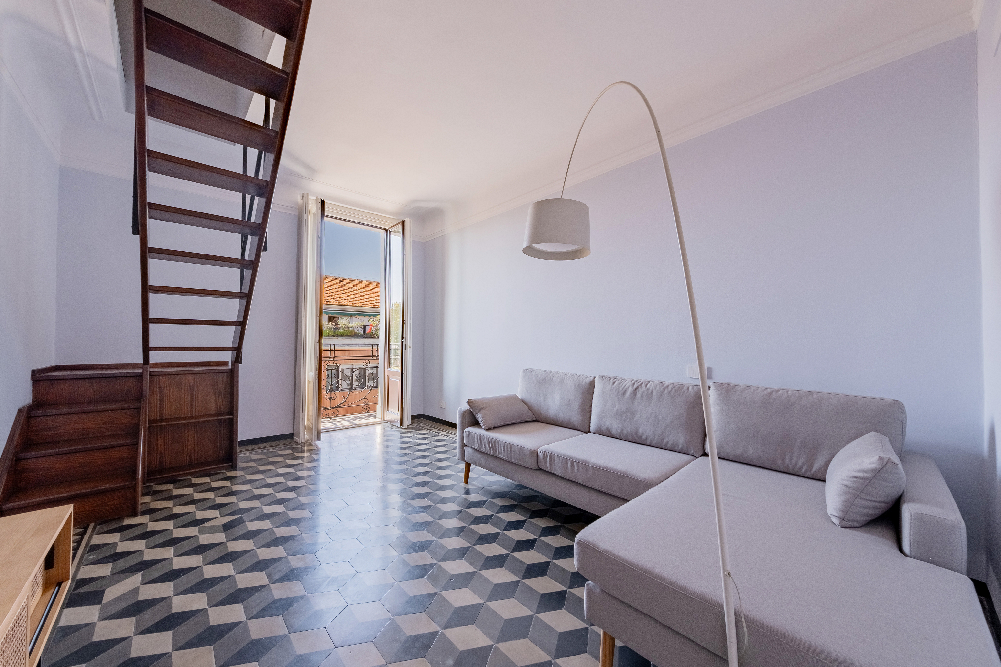 Contemporary elegance and period charm in a two-level apartment on viale Cassiodoro
