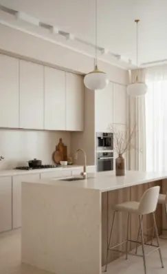 Bright, modern kitchen with white cabinets, island with seating, and pendant lights.