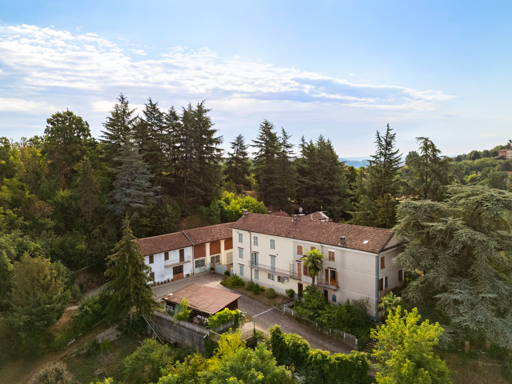Historic hillside villa surrounded by greenery