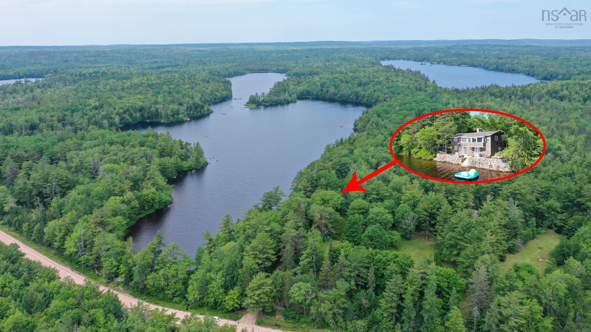 Character-filled home sits on over 9.5 acres with lakefront