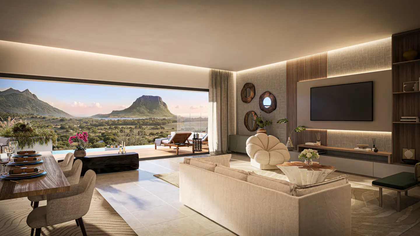 Bright living room with a dining table, sofa, and a view of a mountain landscape through a large window.