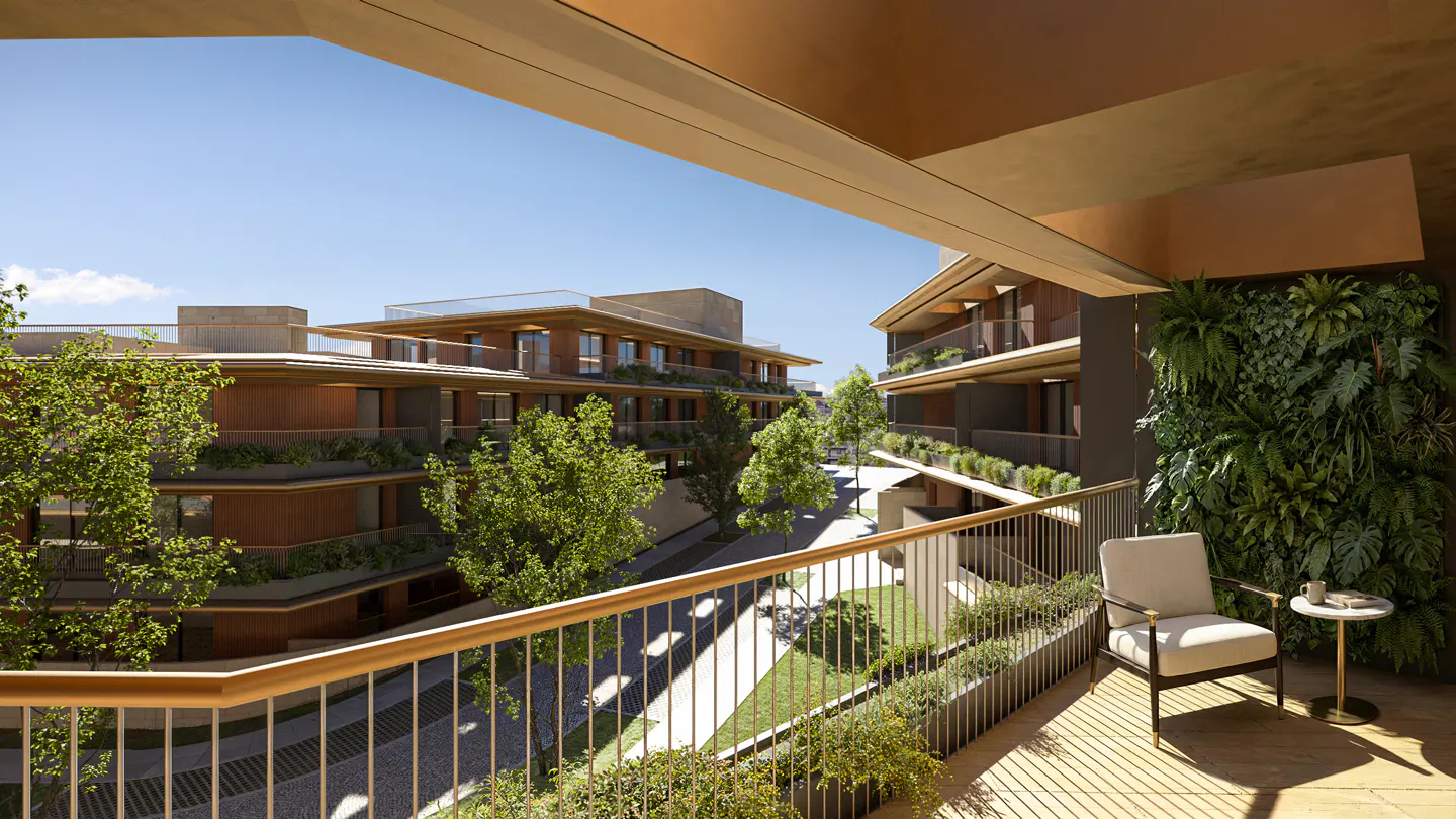 Balcony view of modern apartments with green spaces. Chair and table on balcony with living wall. Sunny day, blue sky.