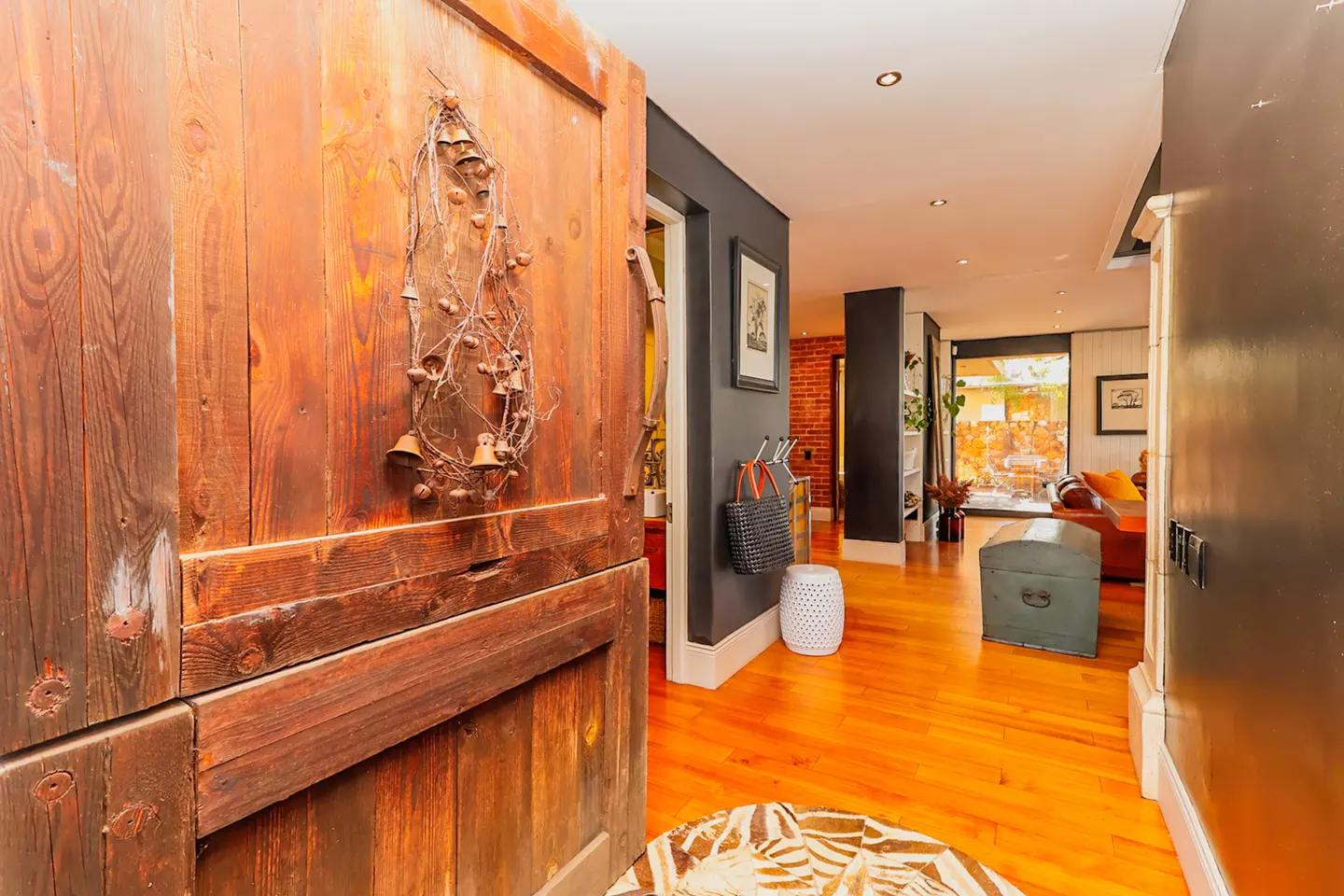 The beautiful entrance has a centre-pivot door and opens up a beautiful living space