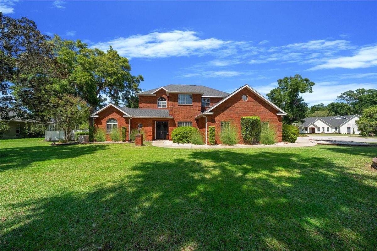Sophisticated Red Brick Estate: Privacy, Pool & Upgrades