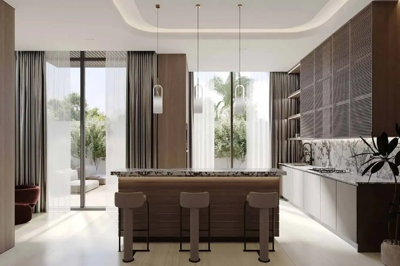 A modern kitchen with a marble countertop island and three stools. Large windows with sheer curtains overlook a lush outdoor space.