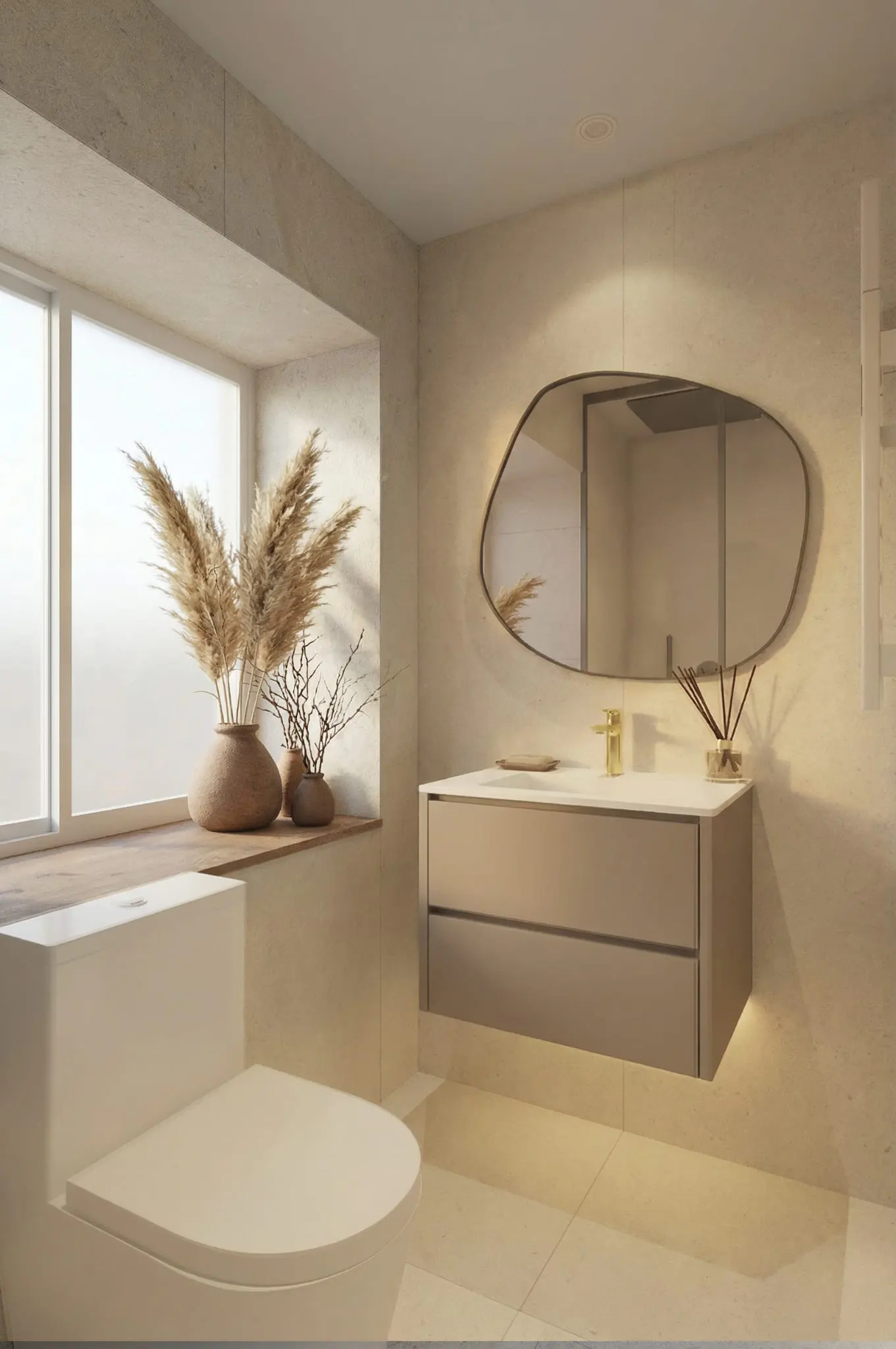 Modern bathroom with beige walls, white toilet, and floating vanity with an asymmetrical mirror. Pampas grass in a vase sits on the windowsill.