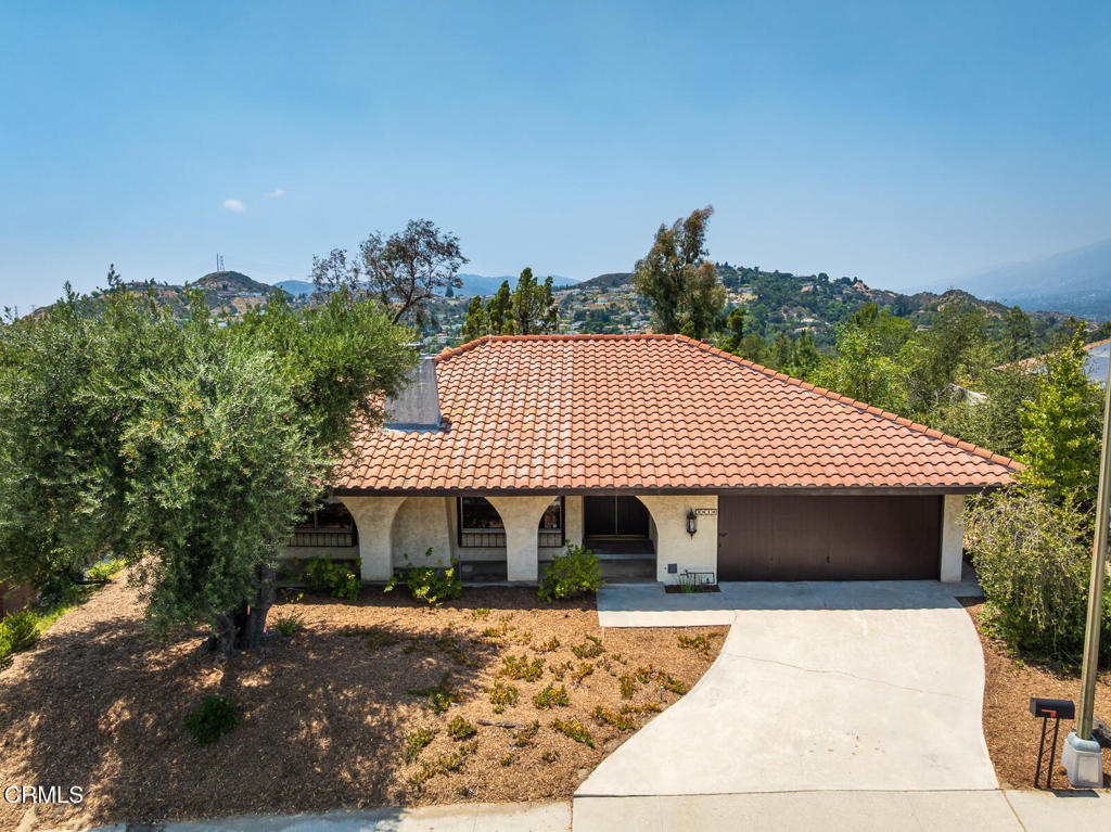 Mid-Century Modern Spanish Ranch home with hillside views