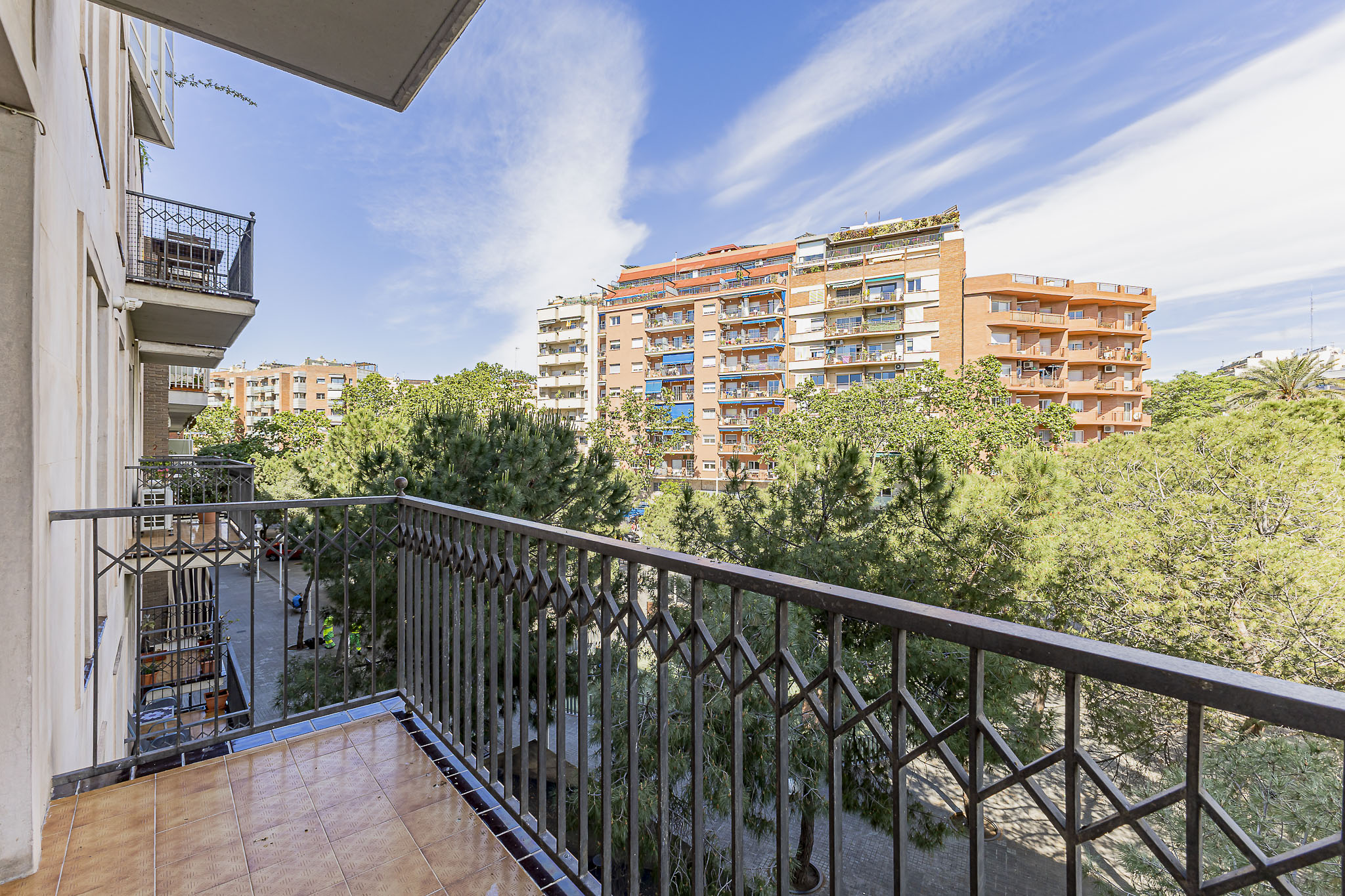 Duplex with balconies and open views