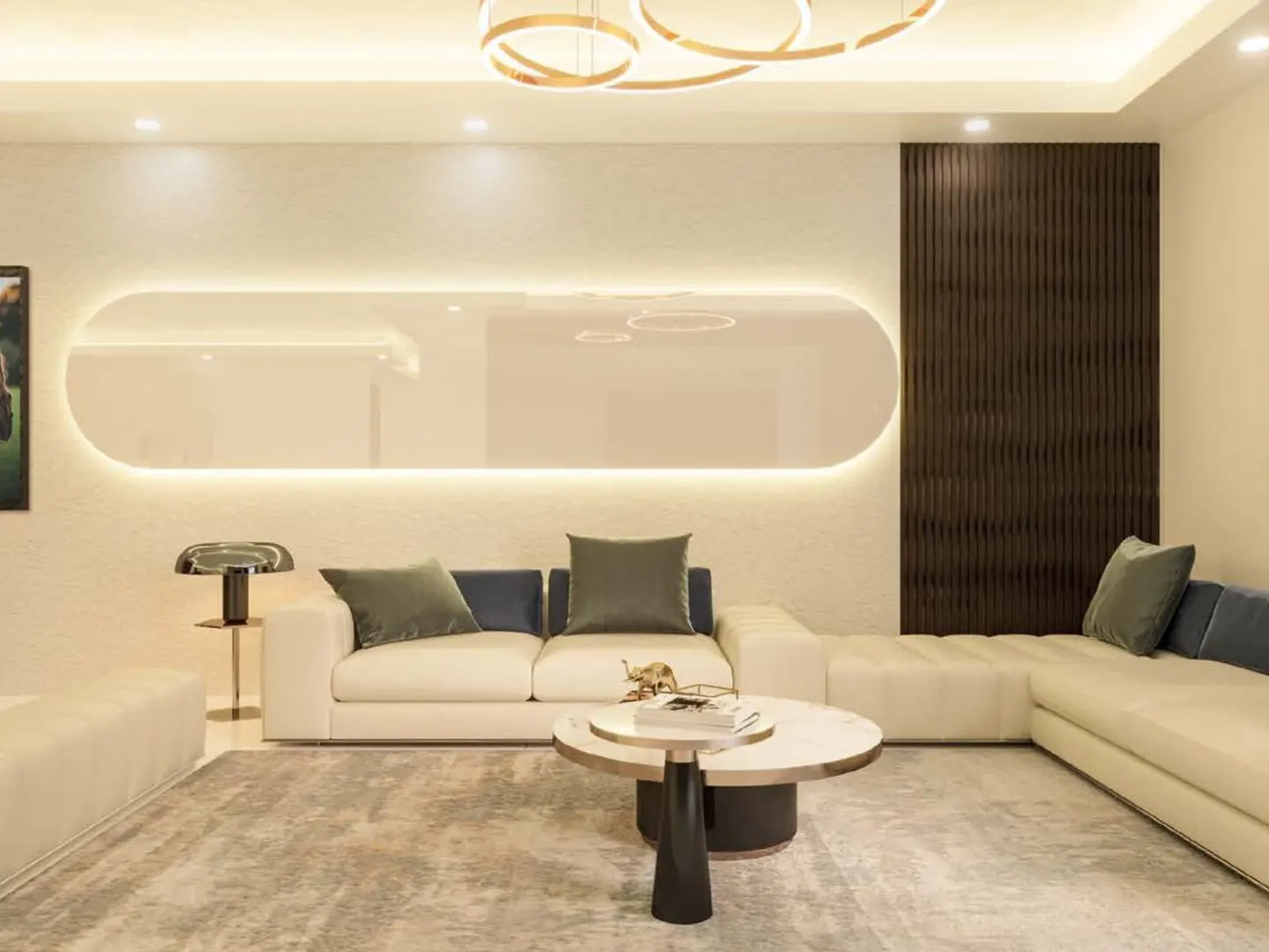 Living room with a white sectional sofa, round marble coffee table, and a long, illuminated wall panel.