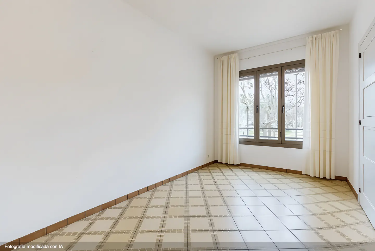 Bright, empty room with white walls, tiled floor, and a window with cream curtains. A white door is visible on the right.