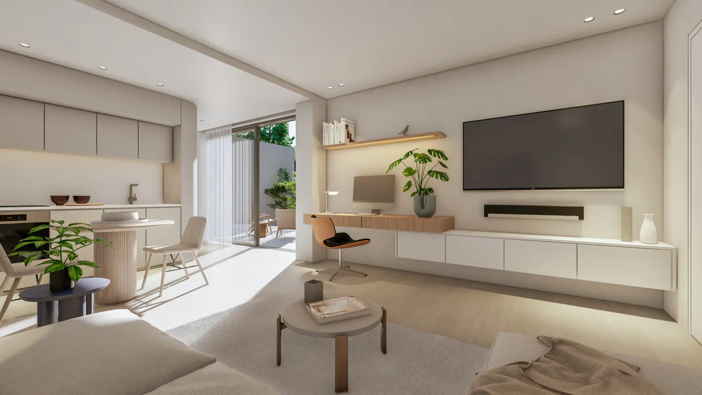 Bright, modern living room with a TV, desk, and kitchen area. A sliding glass door leads to a patio with greenery.