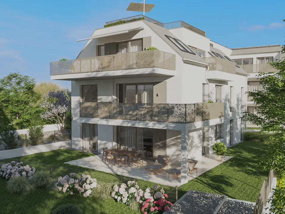 Three-story white building with balconies and a rooftop patio. A patio with furniture and a green lawn are in front.