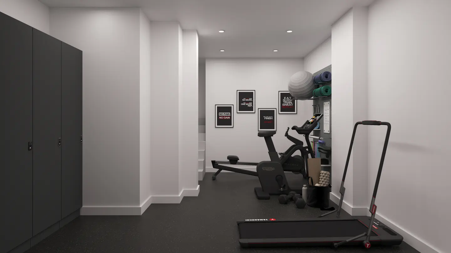 A home gym with black rubber flooring, white walls, and exercise equipment. A treadmill, rowing machine, and stationary bike are visible.