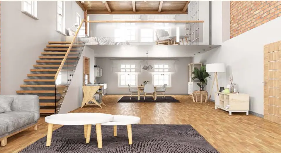 A bright, open-concept living space with a loft. Wooden stairs lead to the loft with a glass railing. A dining area and kitchen are visible.