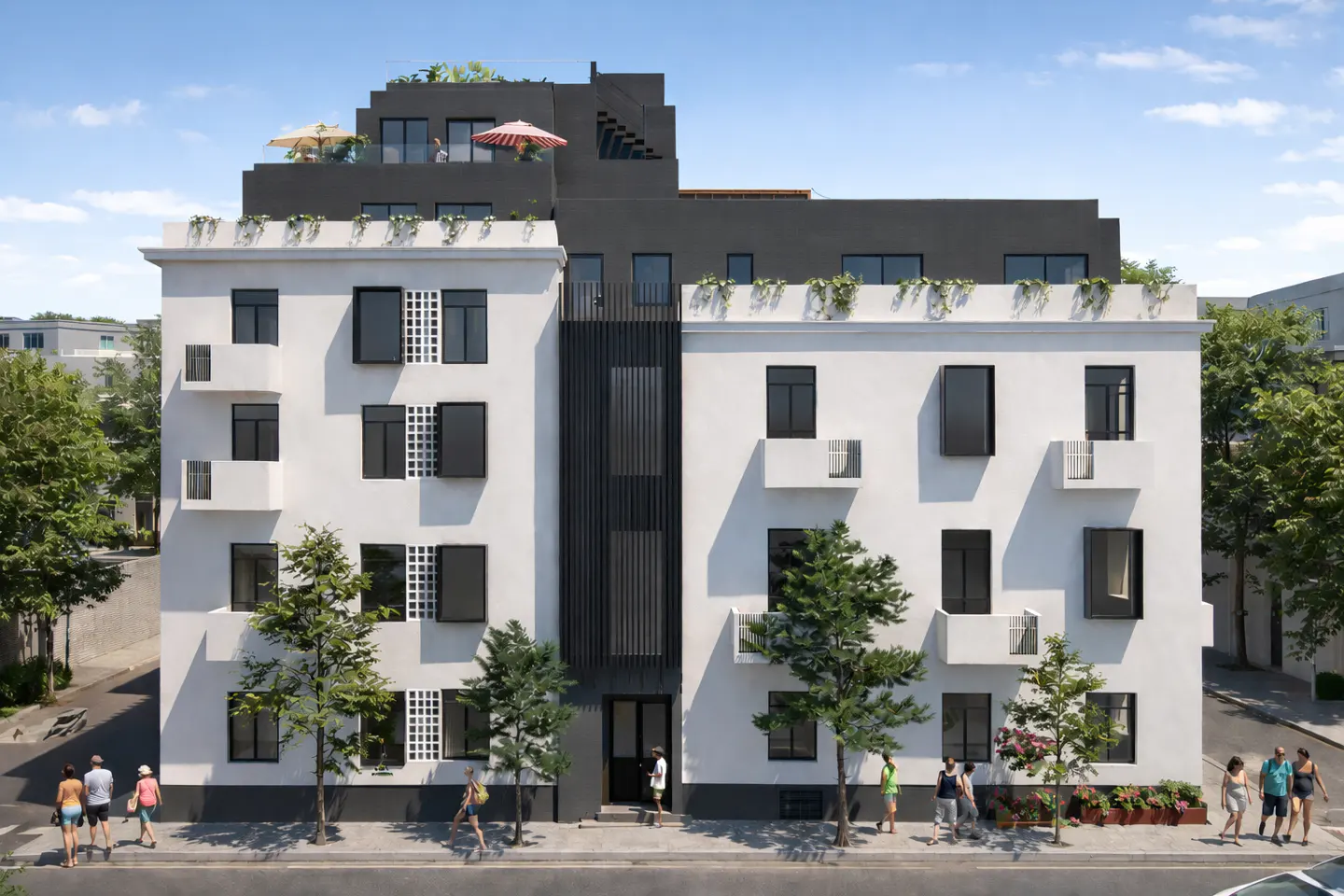 Exterior view of a modern white building with black accents and a rooftop terrace, people walking on the sidewalk.