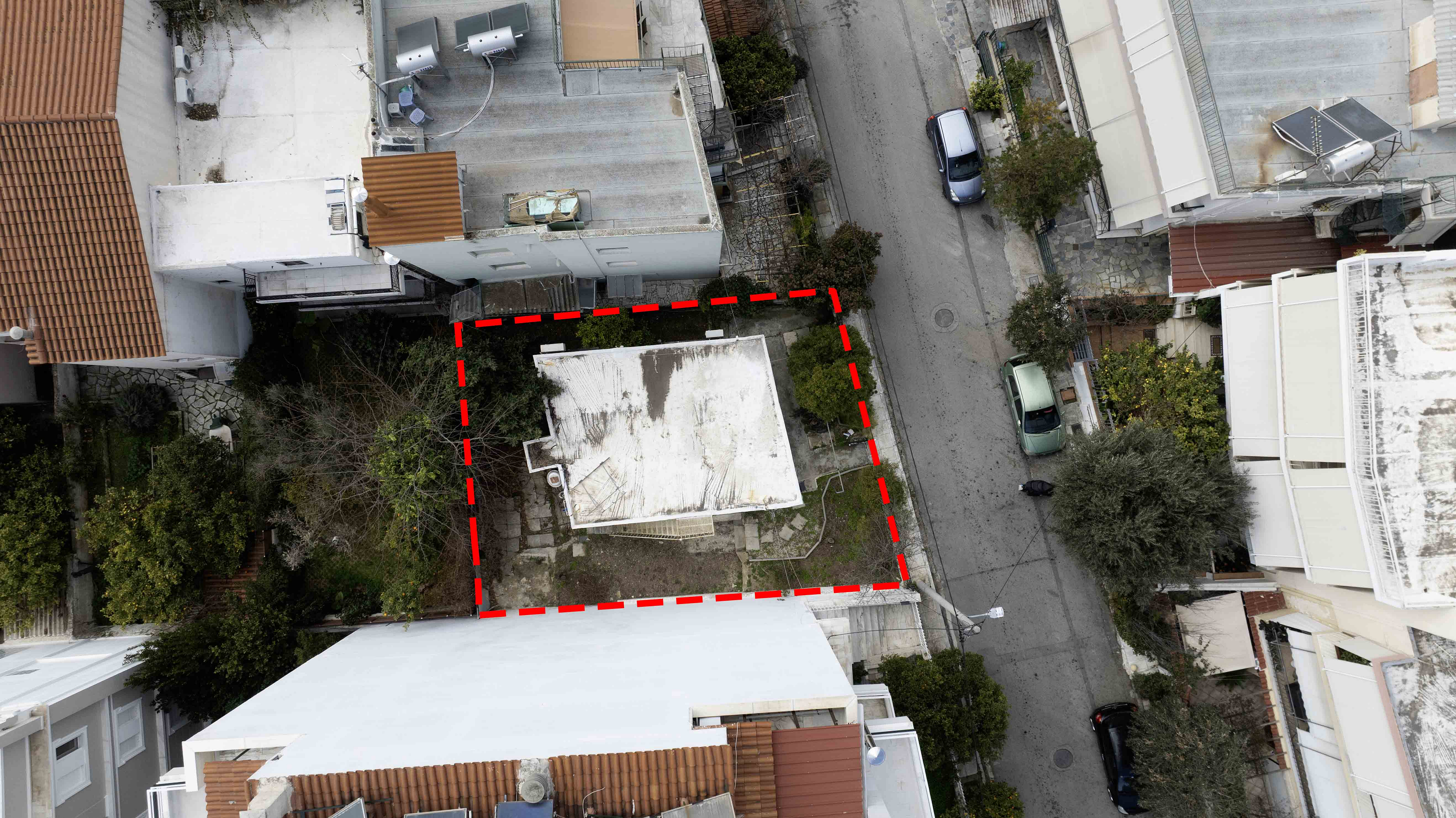 Plot with a small house in Iraklio of Attica