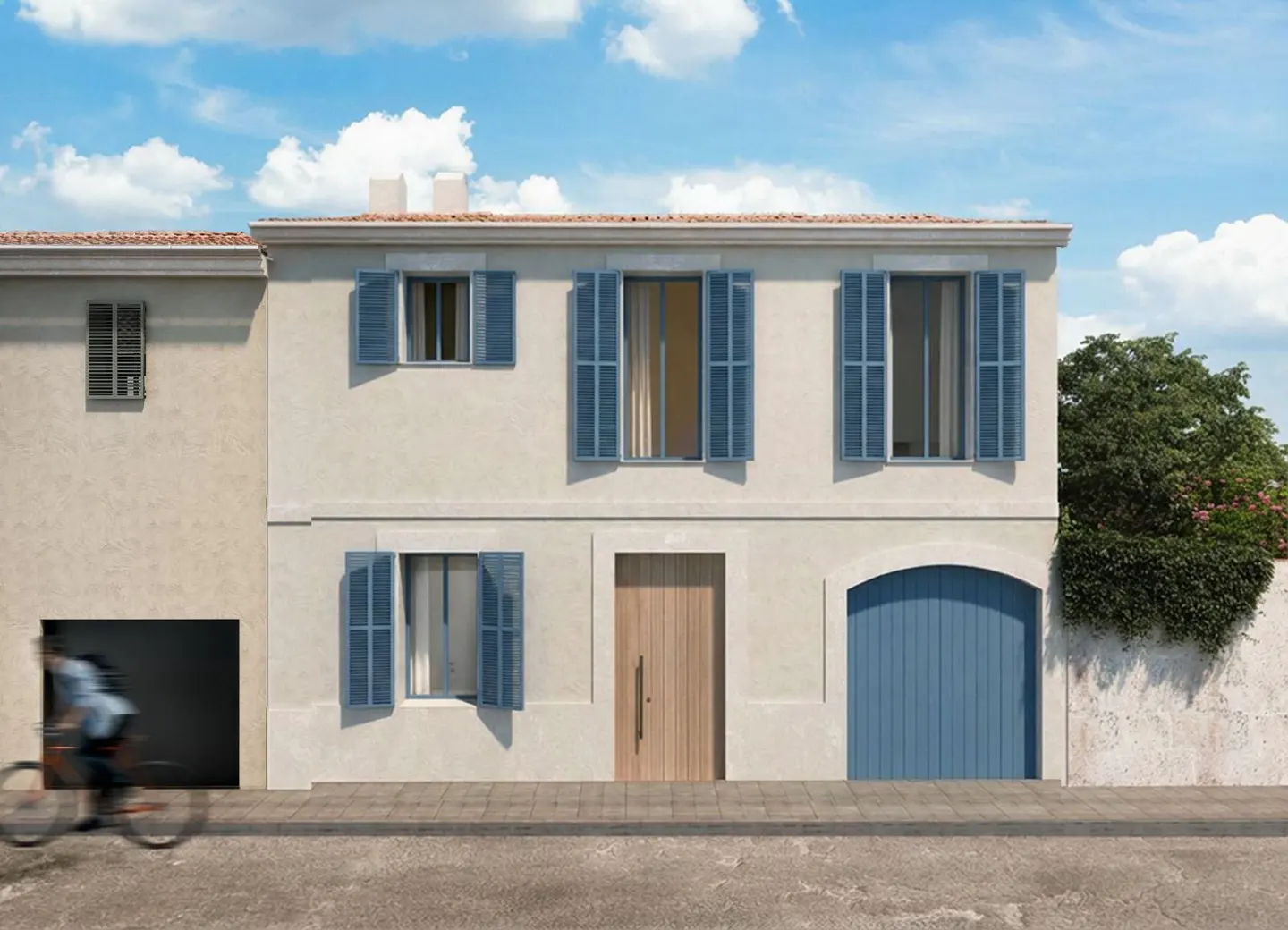 Two-story house with blue shutters and a wooden door. A person on a bicycle passes by on the street.