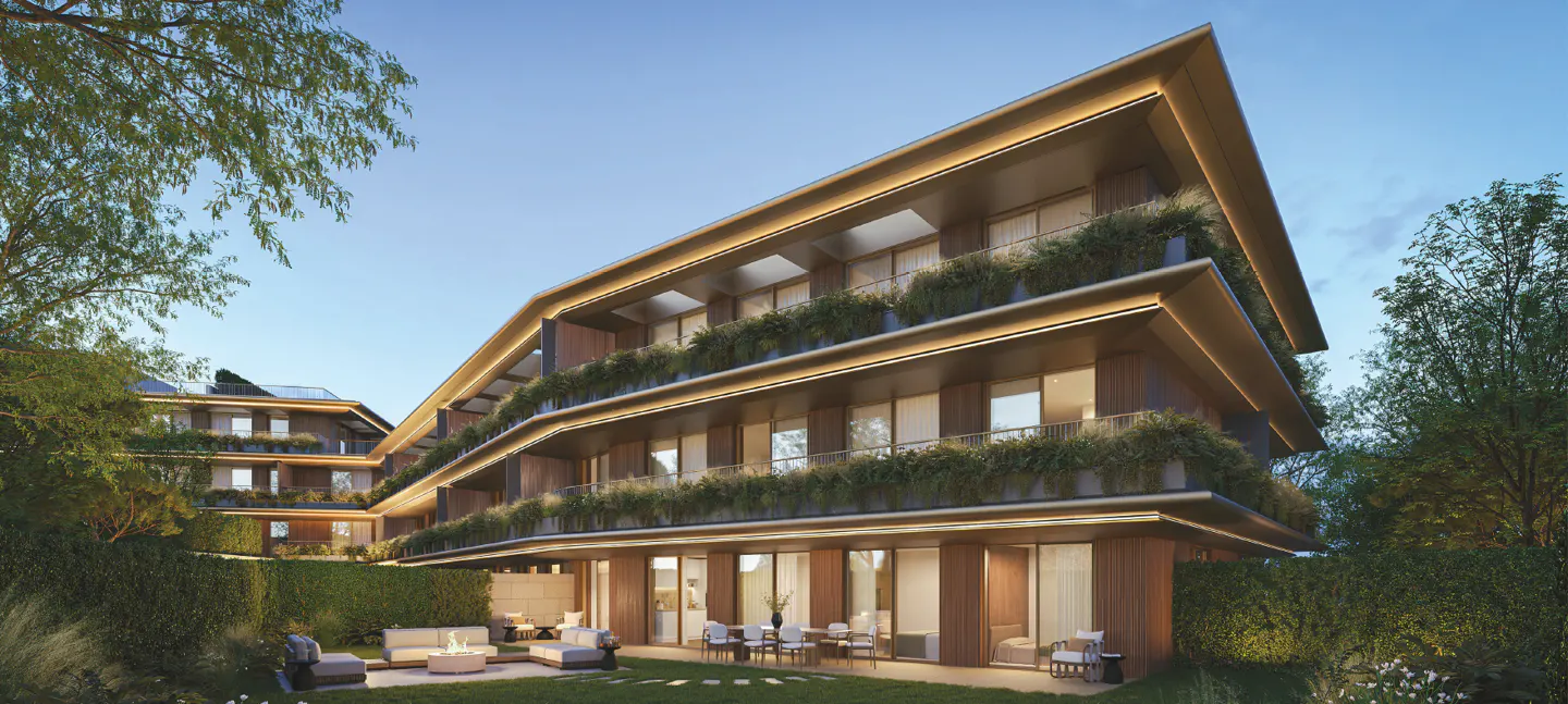 Modern apartment building with wood facade and greenery on balconies. Outdoor seating area with fire pit.