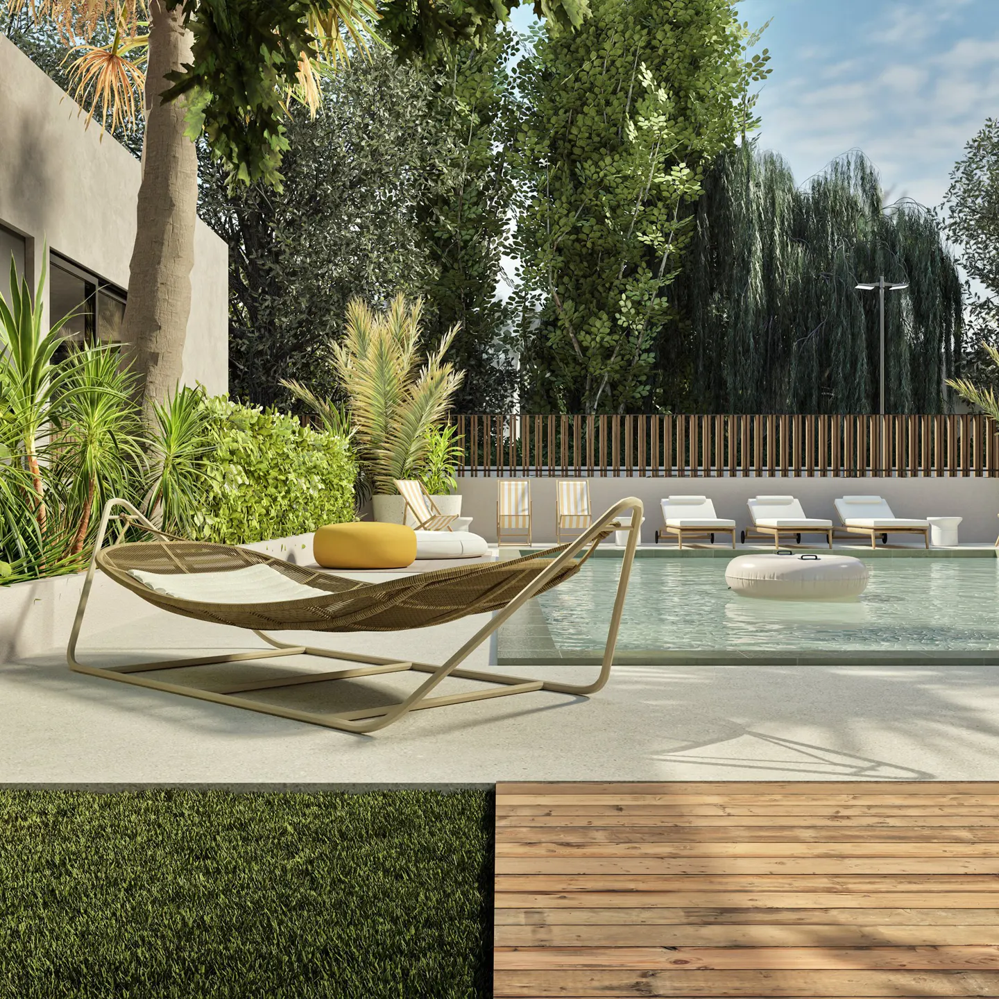 A backyard with a pool, lounge chairs, and a hammock. The pool has a white inflatable in it. There are trees and plants around the pool.