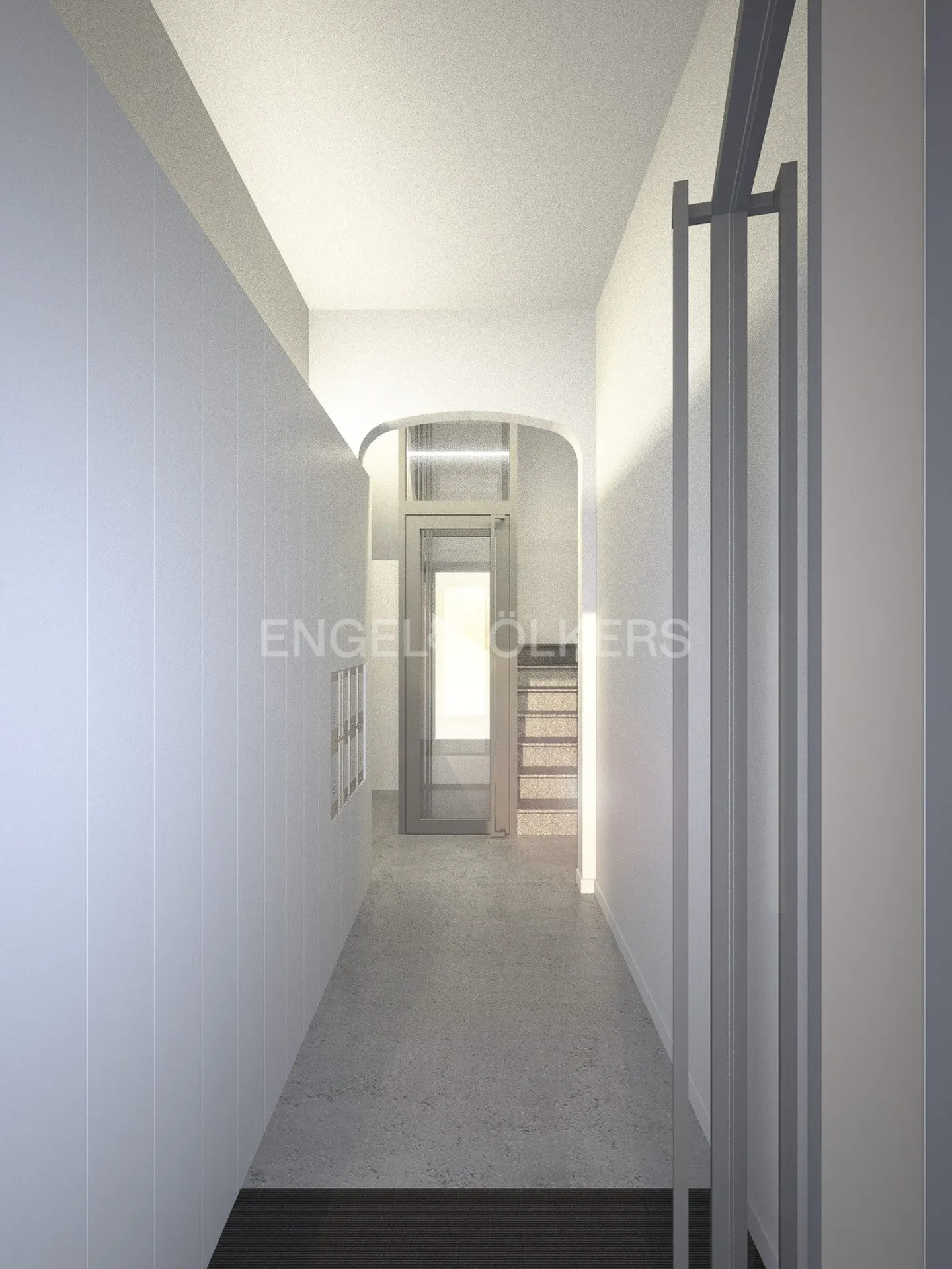 A bright, white hallway with a gray floor leads to an arched doorway with stairs beyond. A white storage unit lines the left wall.
