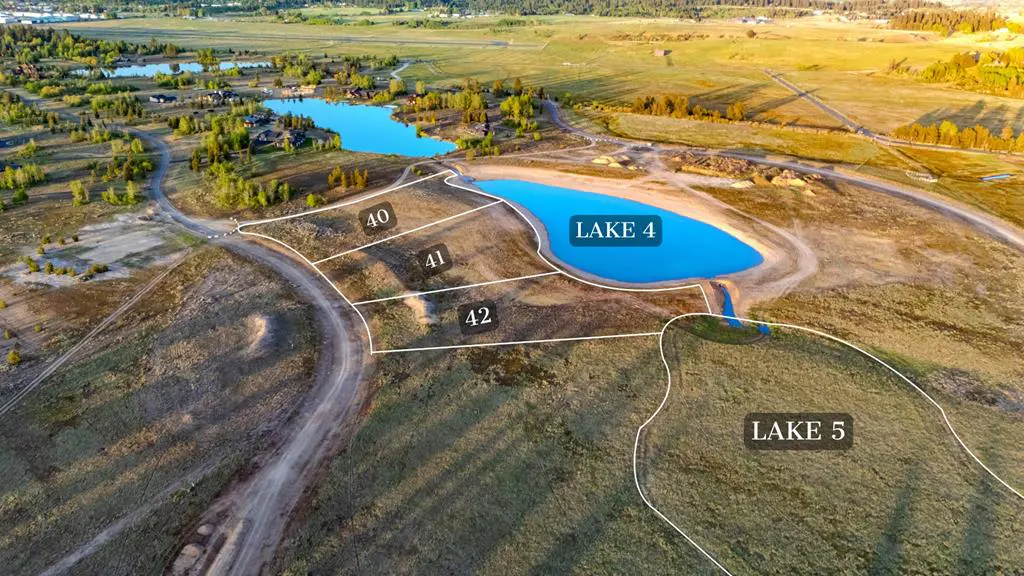 Aerial view of rural land plots 40, 41, and 42 bordering a bright blue lake, with Lake 5 visible in the foreground.