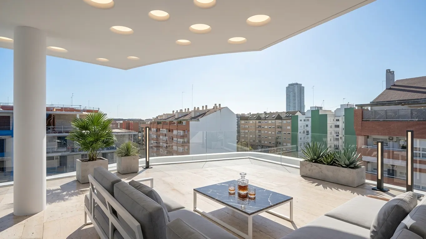 Modern rooftop terrace with gray couches, marble table with decanter, potted plants, and city views under a white ceiling with circular lights.