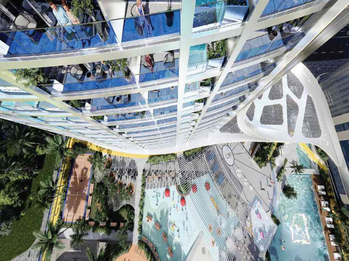 High-angle view of a modern high-rise building with glass balconies, overlooking a pool, playground, and sports court.