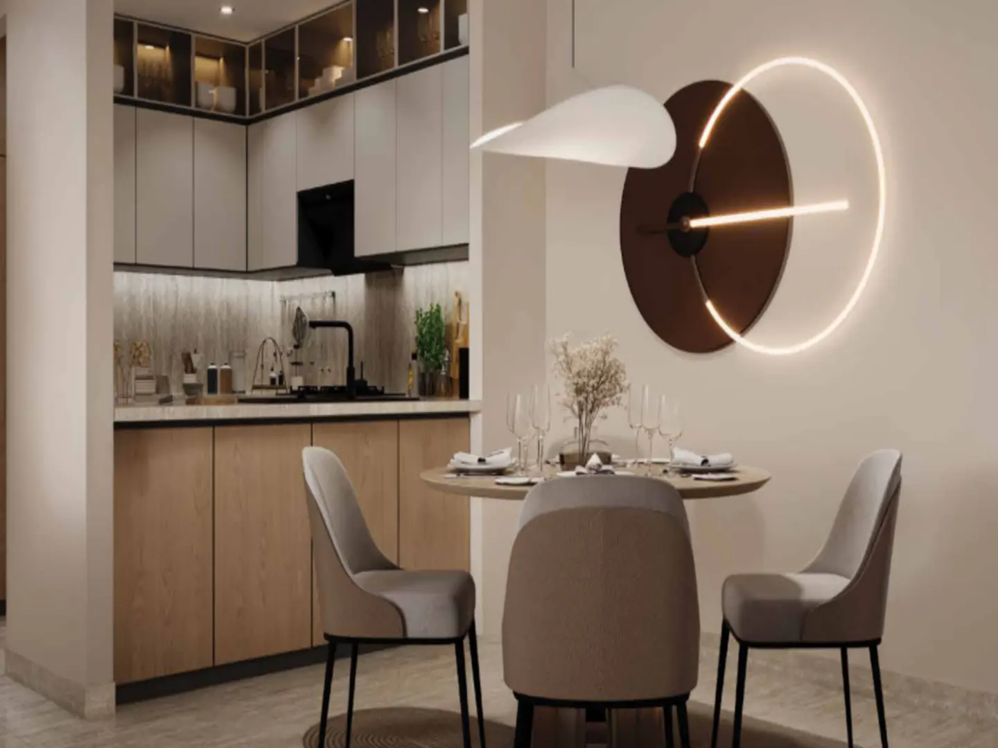 A modern dining area with a round table, three chairs, and a unique wall light fixture. The kitchen is visible in the background.