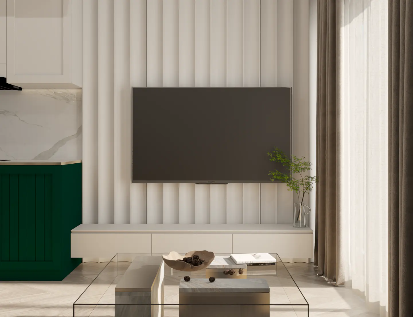 Living room with a flat screen TV on a white wall, a glass table, and green cabinets.
